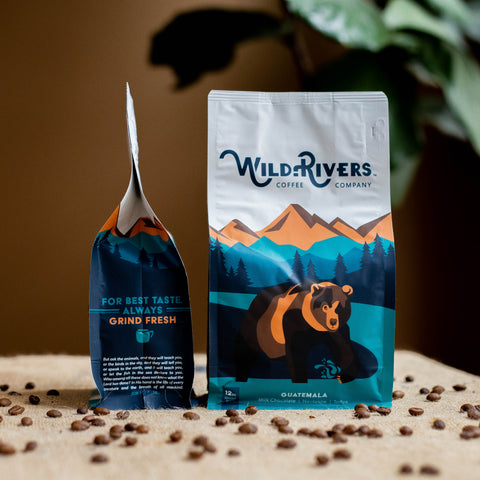 12 oz. Guatemalan coffee bag with a mountain scene and illustration of a Grizzly Bear with Wild Rivers Logo. Tasting notes for this coffee include: Milk Chocolate, Nectarine, Toffee for a 3 month gift subscription