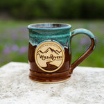 Handmade, ceramic chestnut with green color 12 oz mug with Wild Rivers Logo and "Coffee for Conservation" on the center